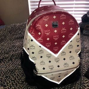 Red black and white MCM bag with reflective detail